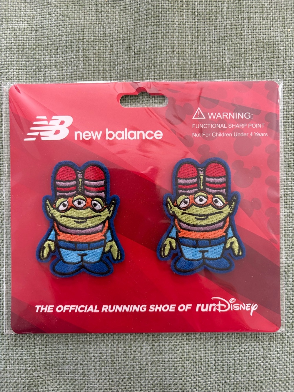 New Balance Disney Toy Story Aliens shoelace clips in package